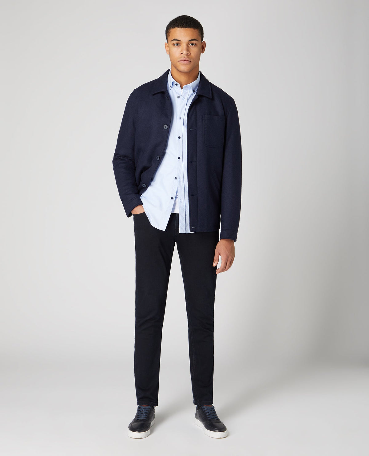 Man wearing a blue Tapered Fit Oxford Cotton Shirt