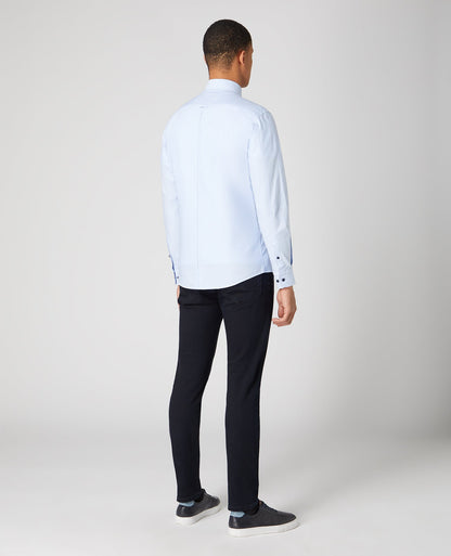 Man wearing a blue Tapered Fit Oxford Cotton Shirt