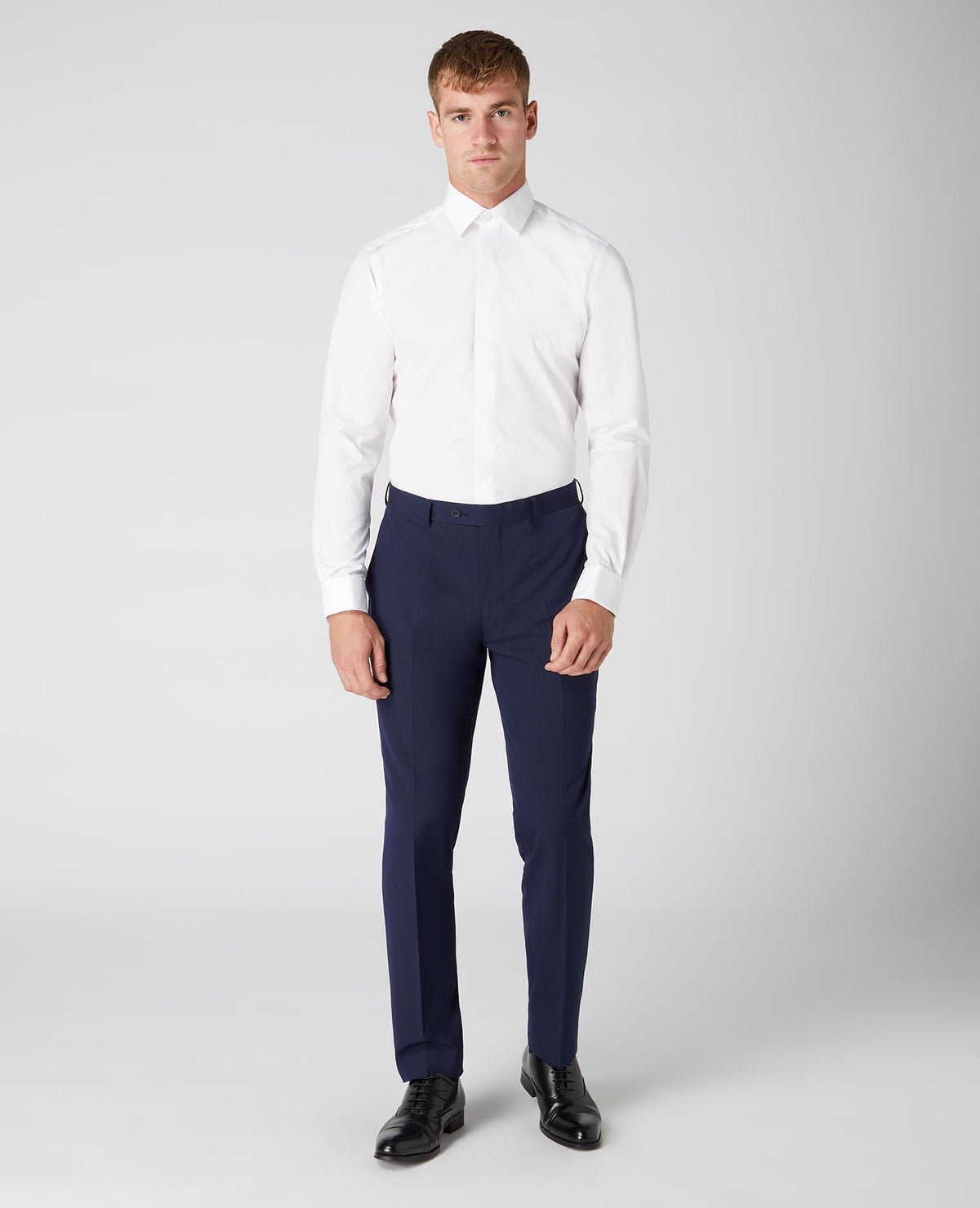 Man wearing a white Tapered Fit Cotton-Blend Shirt
