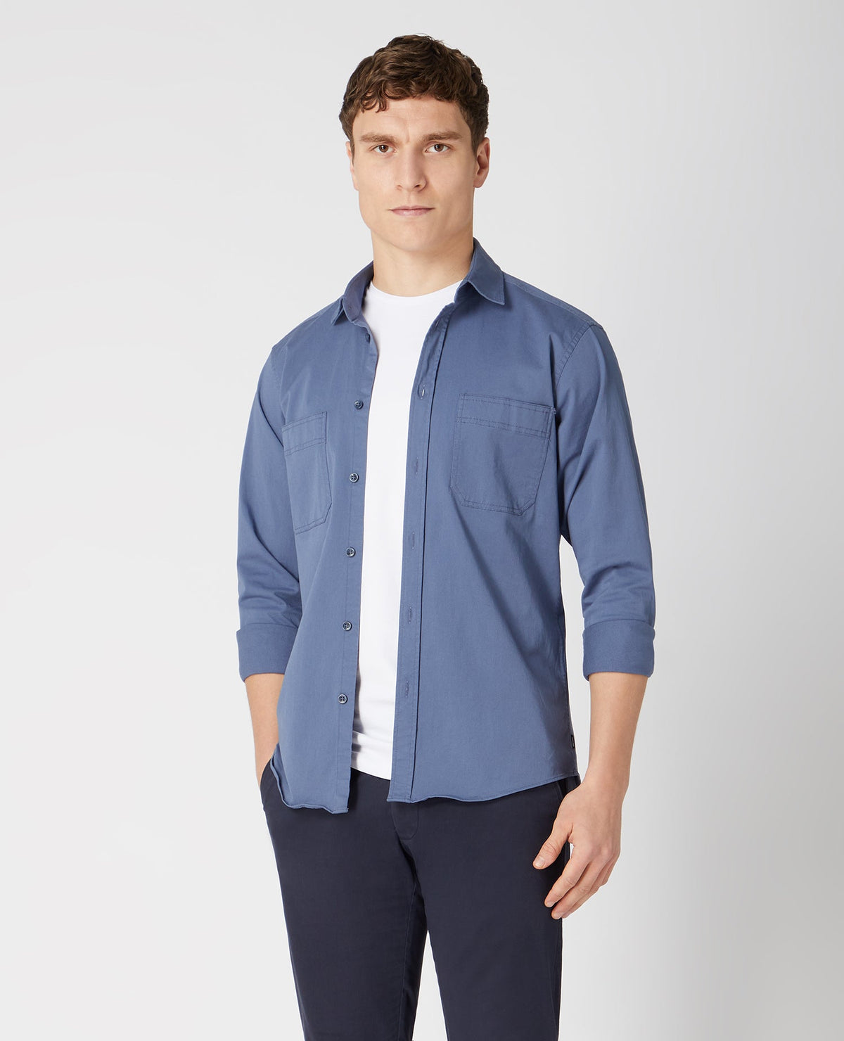 Man wearing a blue Tapered Fit Cotton Stretch Shirt