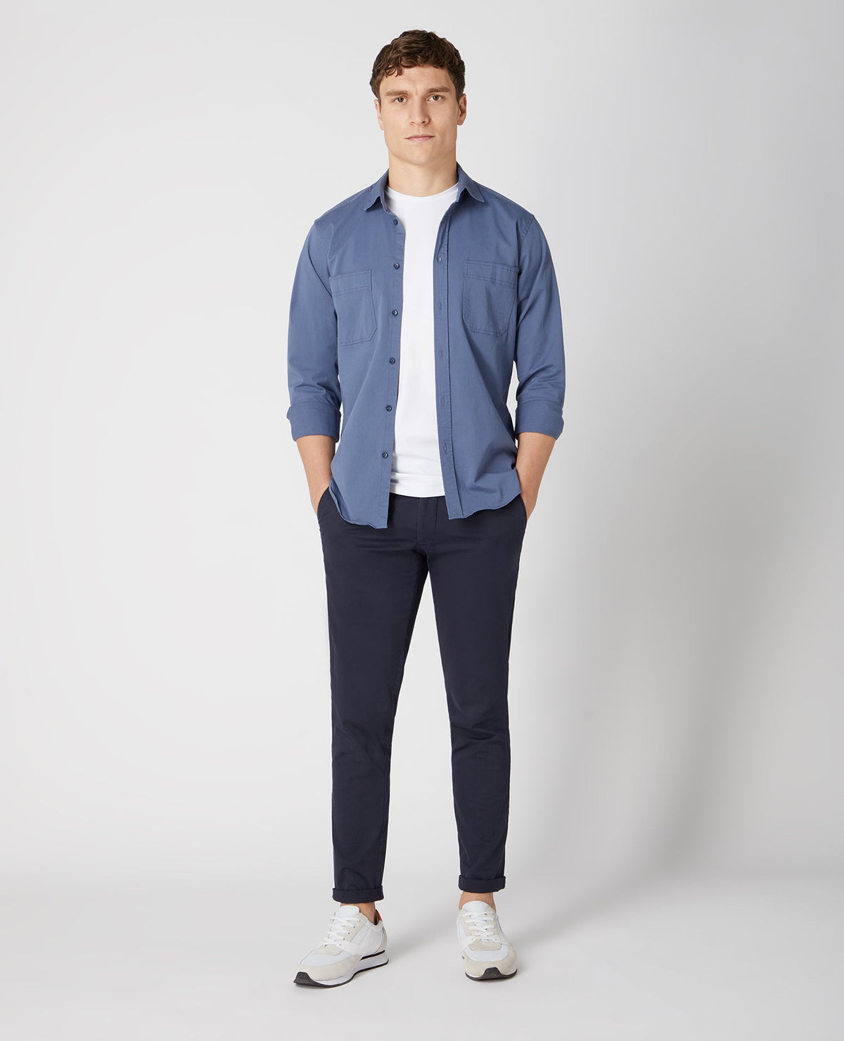 Man wearing a blue Tapered Fit Cotton Stretch Shirt