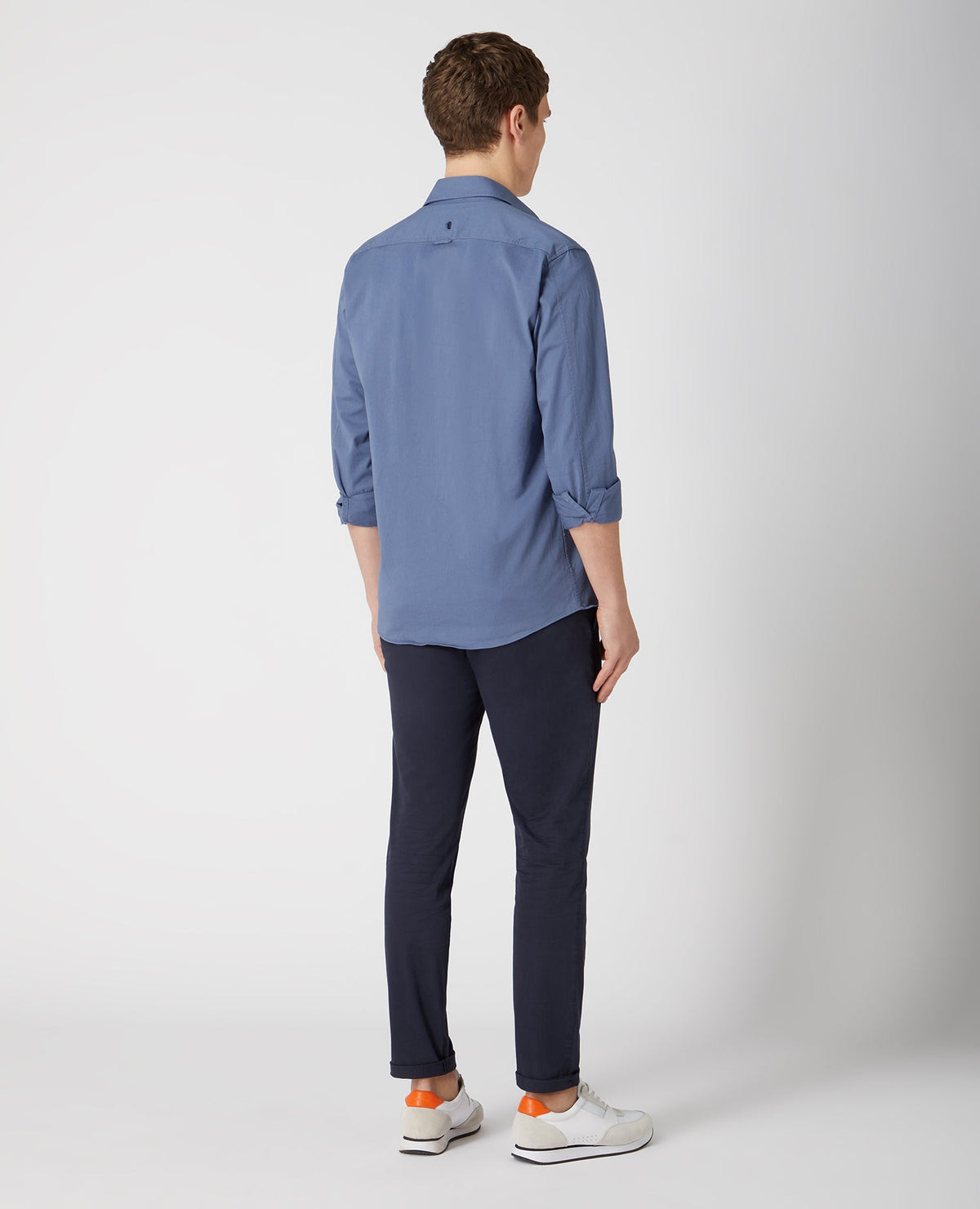 Man wearing a blue Tapered Fit Cotton Stretch Shirt