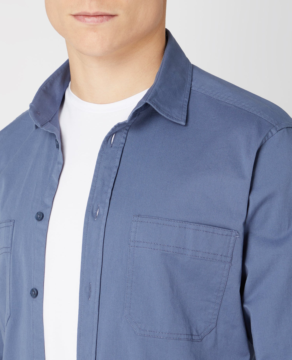Man wearing a blue Tapered Fit Cotton Stretch Shirt