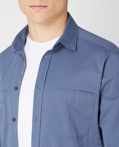 Man wearing a blue Tapered Fit Cotton Stretch Shirt