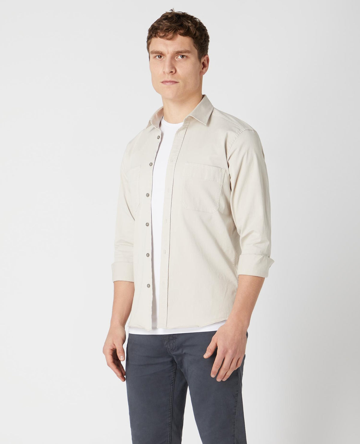 Man wearing a sand Tapered Fit Cotton Stretch Shirt
