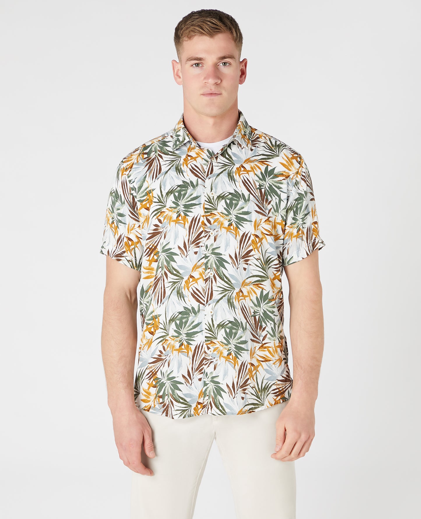 Man wearing a white and brown casual shirt