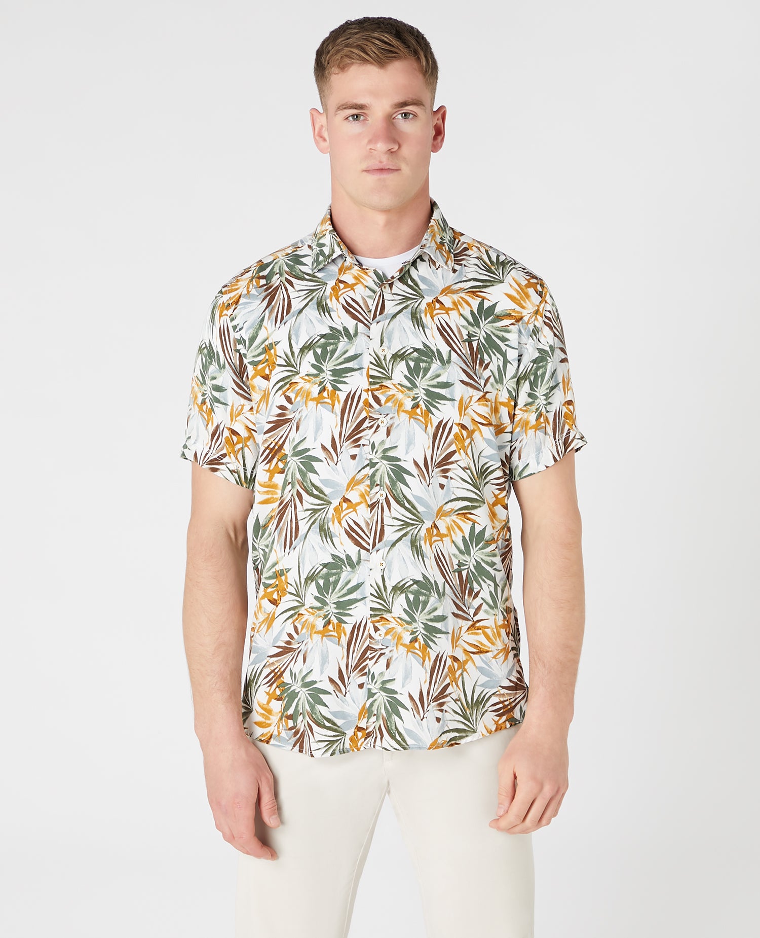 Man wearing a white and brown casual shirt