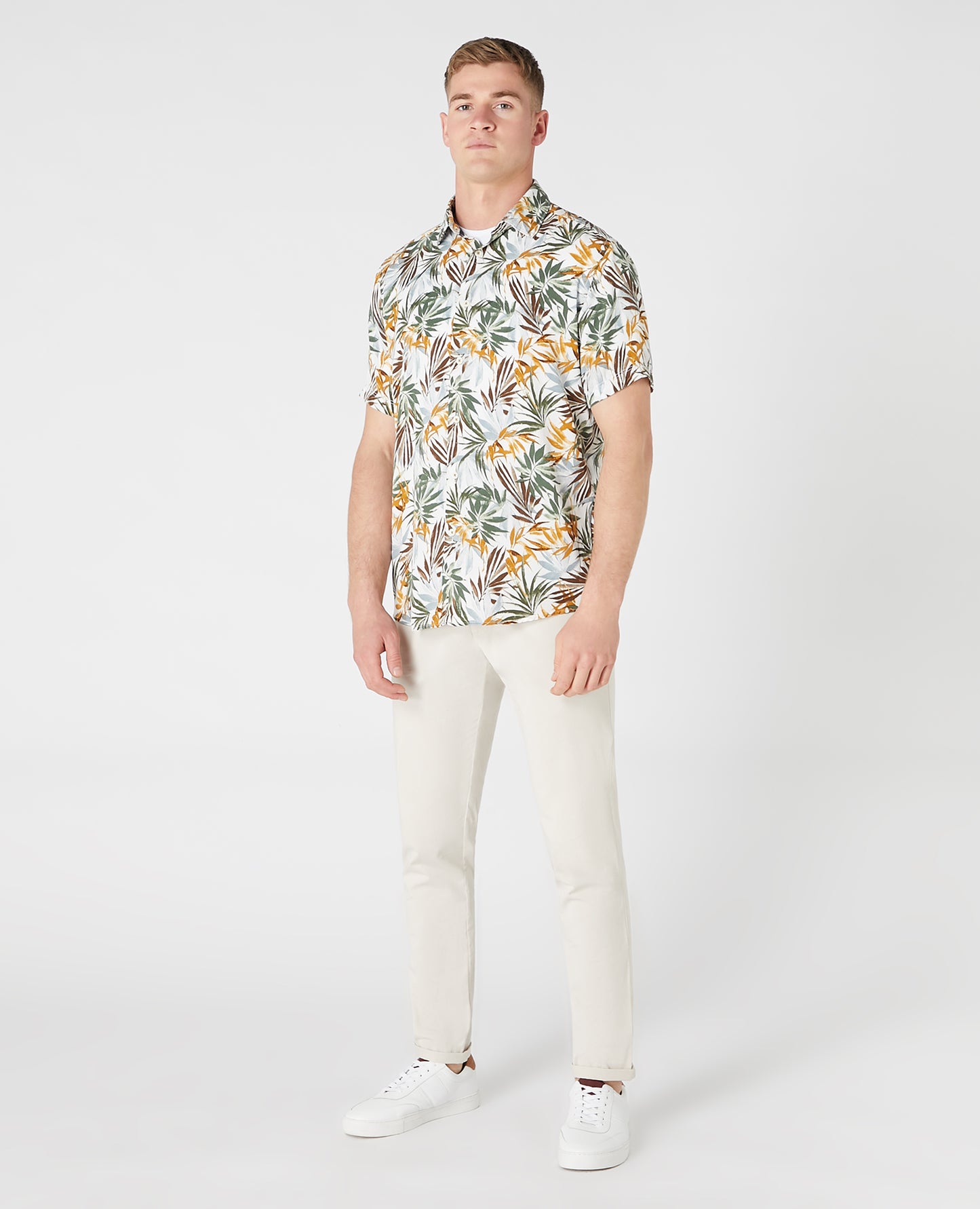 Man wearing a white and brown casual shirt