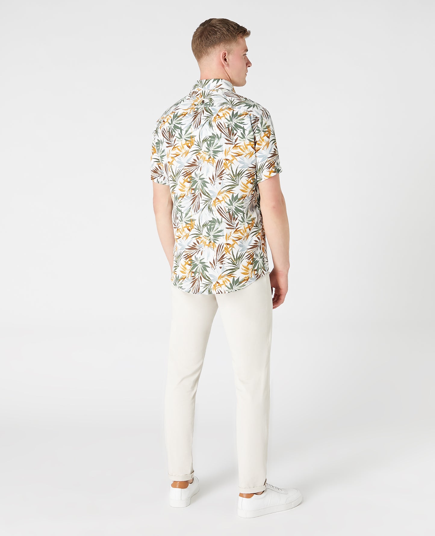 Man wearing a white and brown casual shirt