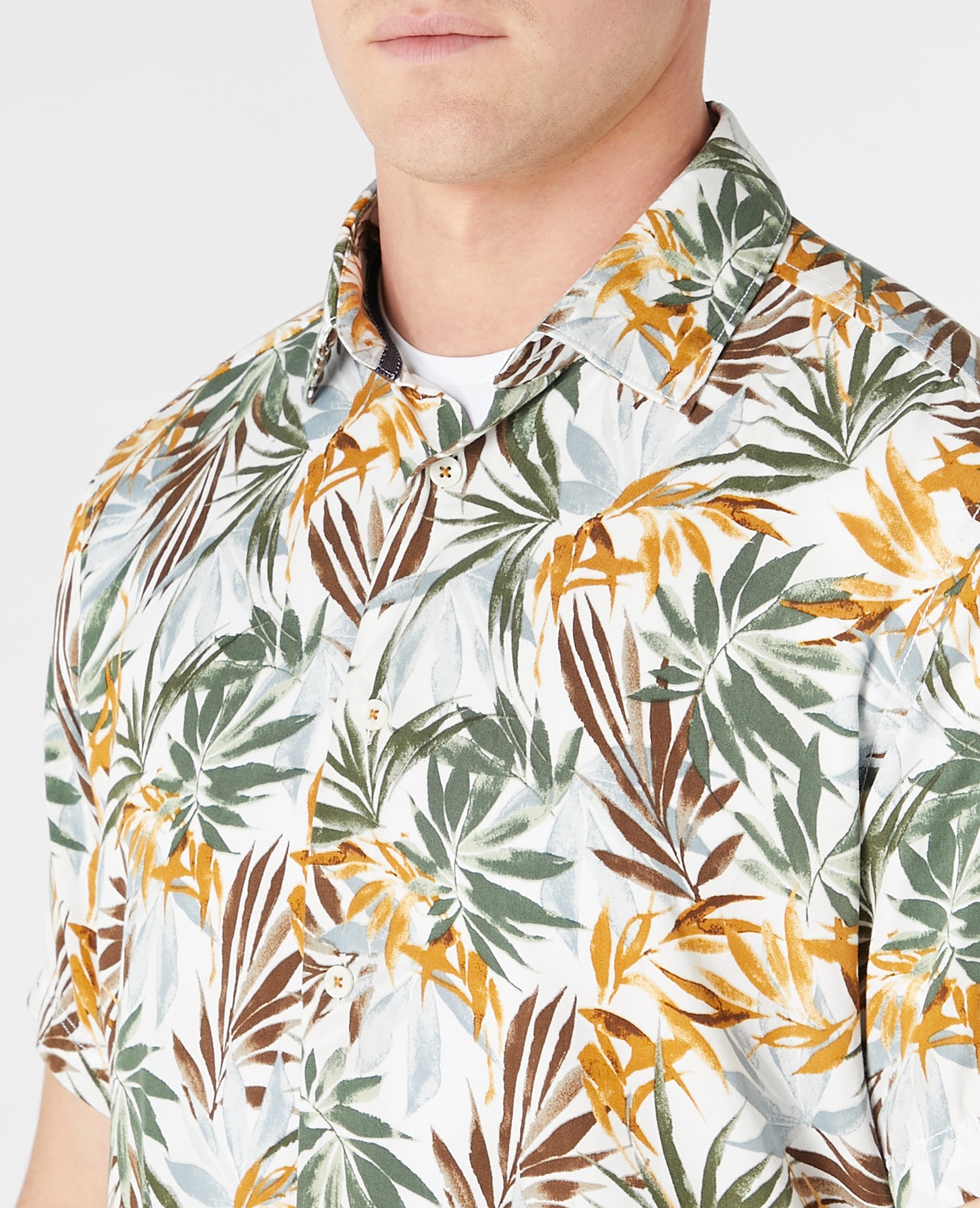Man wearing a white and brown casual shirt