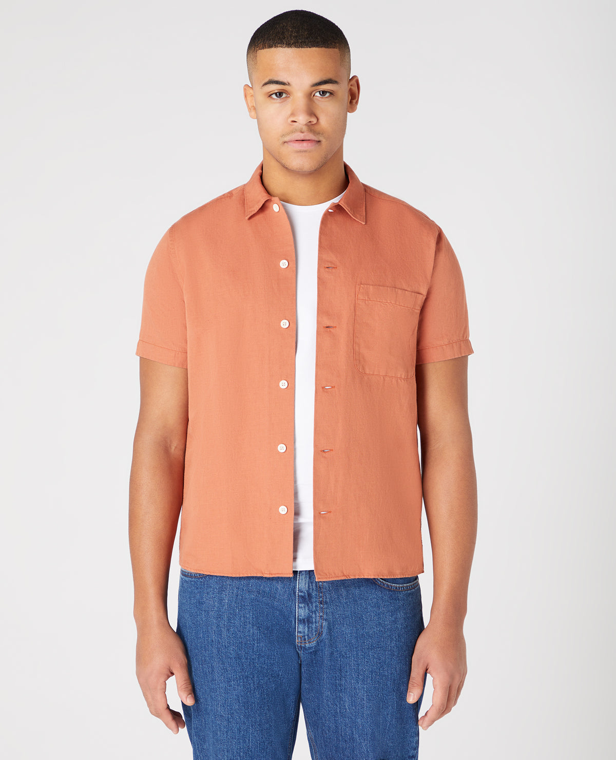 Man wearing a orange Tapered Fit Linen-Blend Short Sleeve Shirt