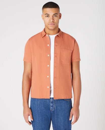 Man wearing a orange Tapered Fit Linen-Blend Short Sleeve Shirt
