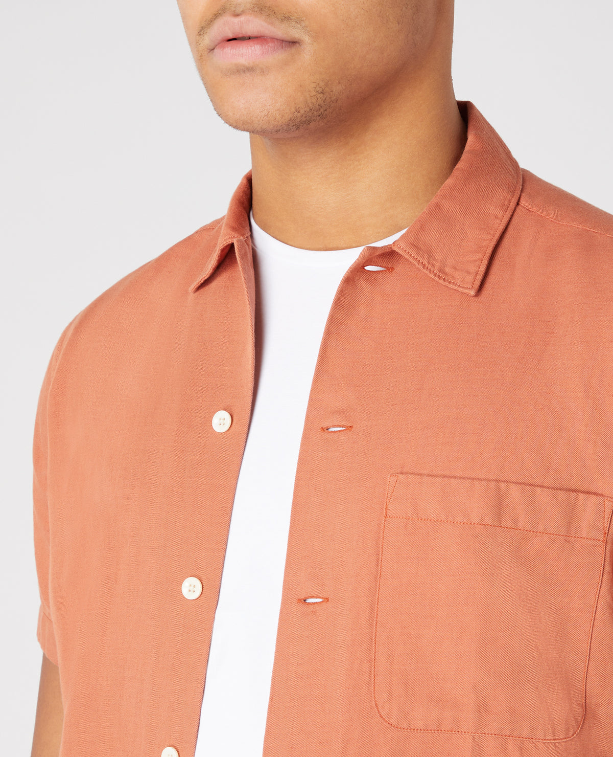 Man wearing a orange Tapered Fit Linen-Blend Short Sleeve Shirt