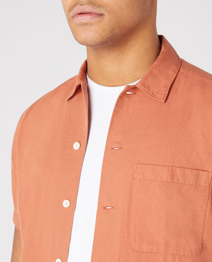 Man wearing a orange Tapered Fit Linen-Blend Short Sleeve Shirt