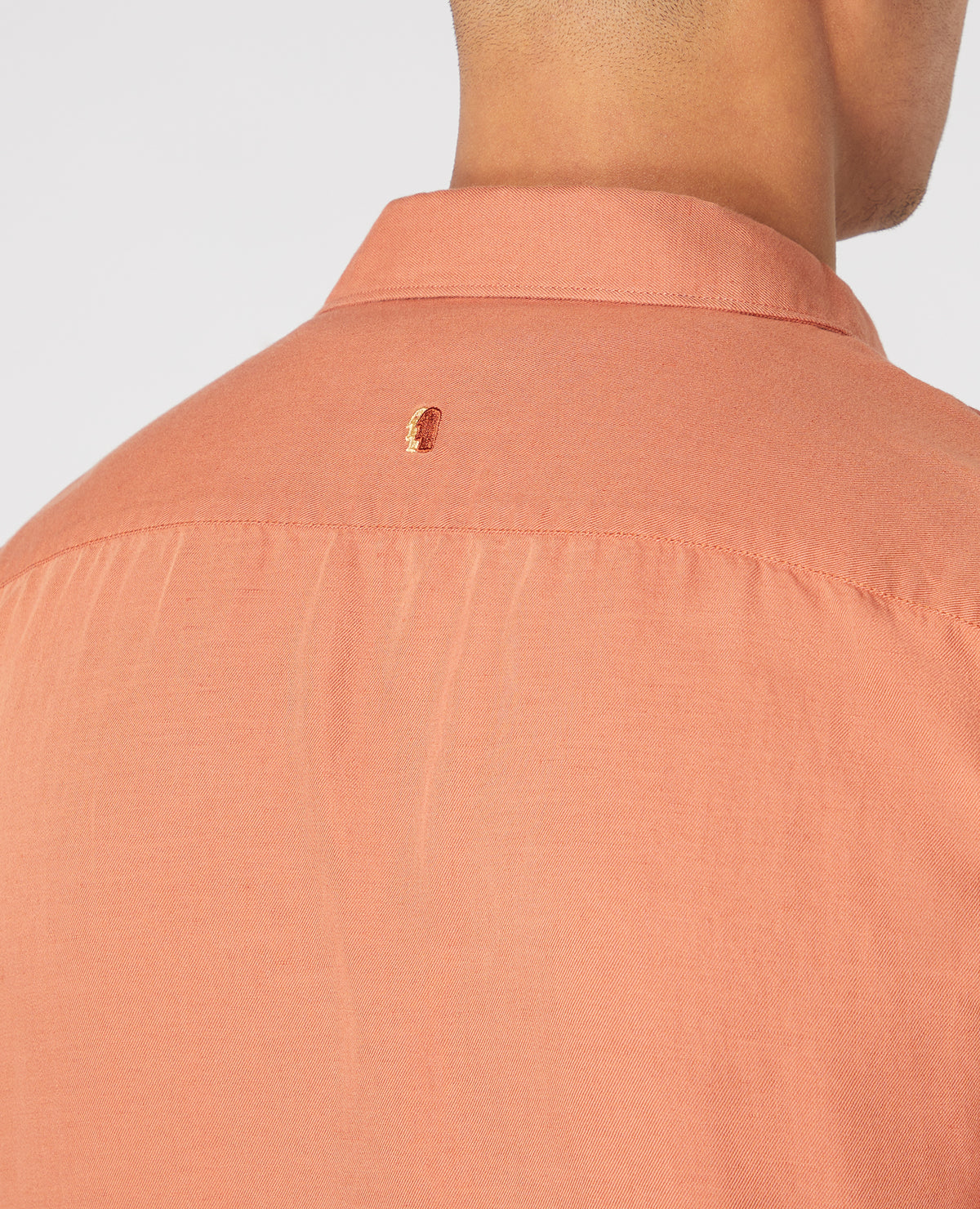 Man wearing a orange Tapered Fit Linen-Blend Short Sleeve Shirt