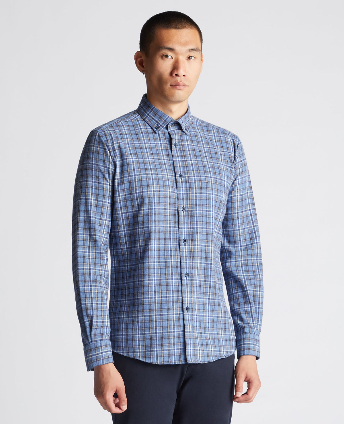 Man wearing a blue Tapered Fit Checked Cotton-Blend Shirt