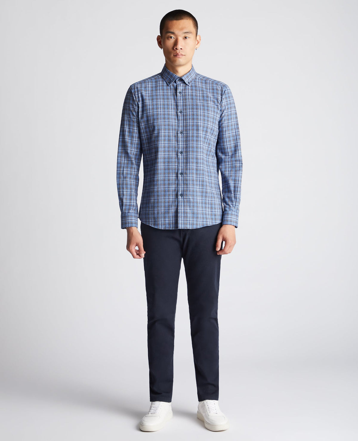 Man wearing a blue Tapered Fit Checked Cotton-Blend Shirt