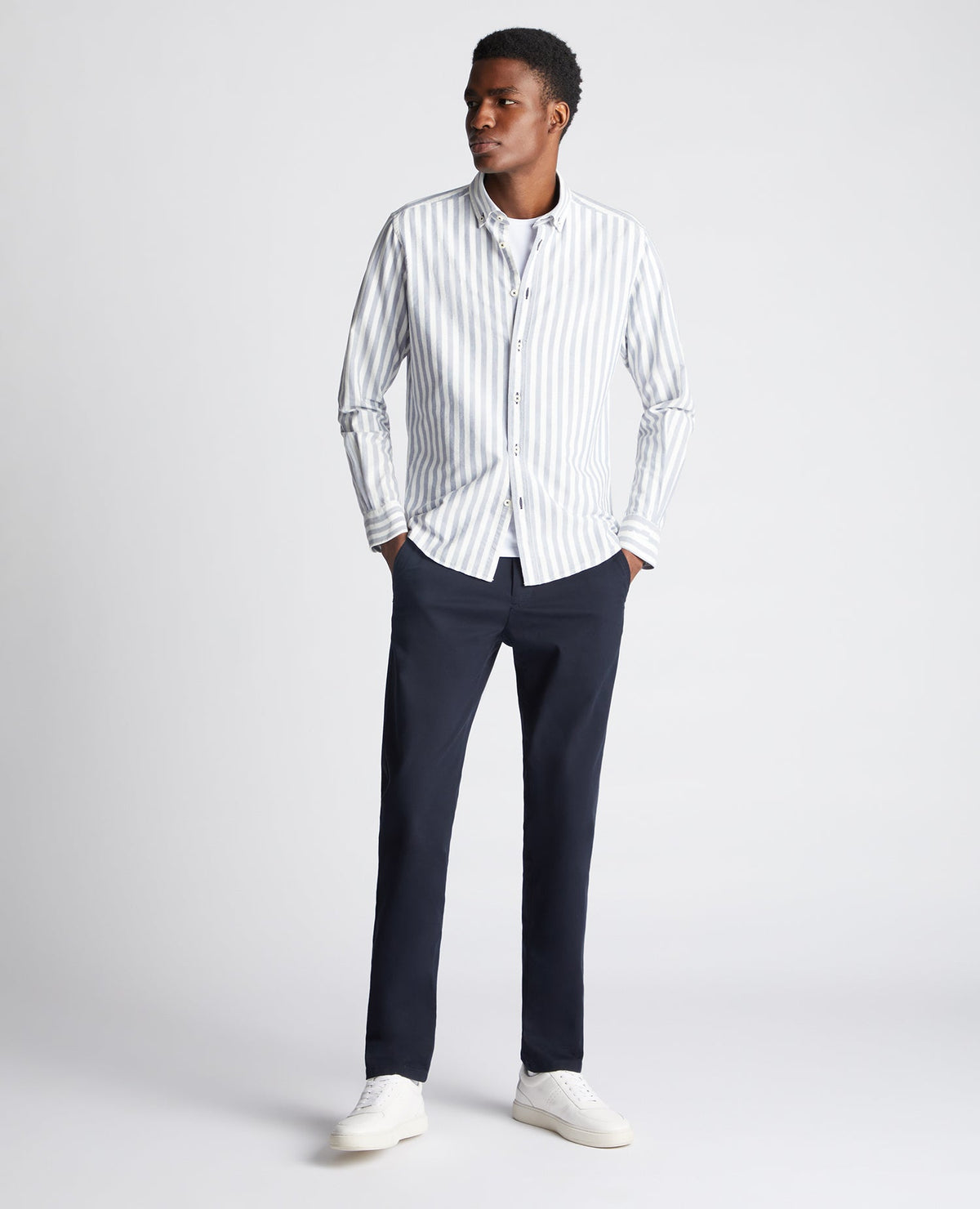 Man wearing a navy Tapered Fit Striped Cotton Shirt