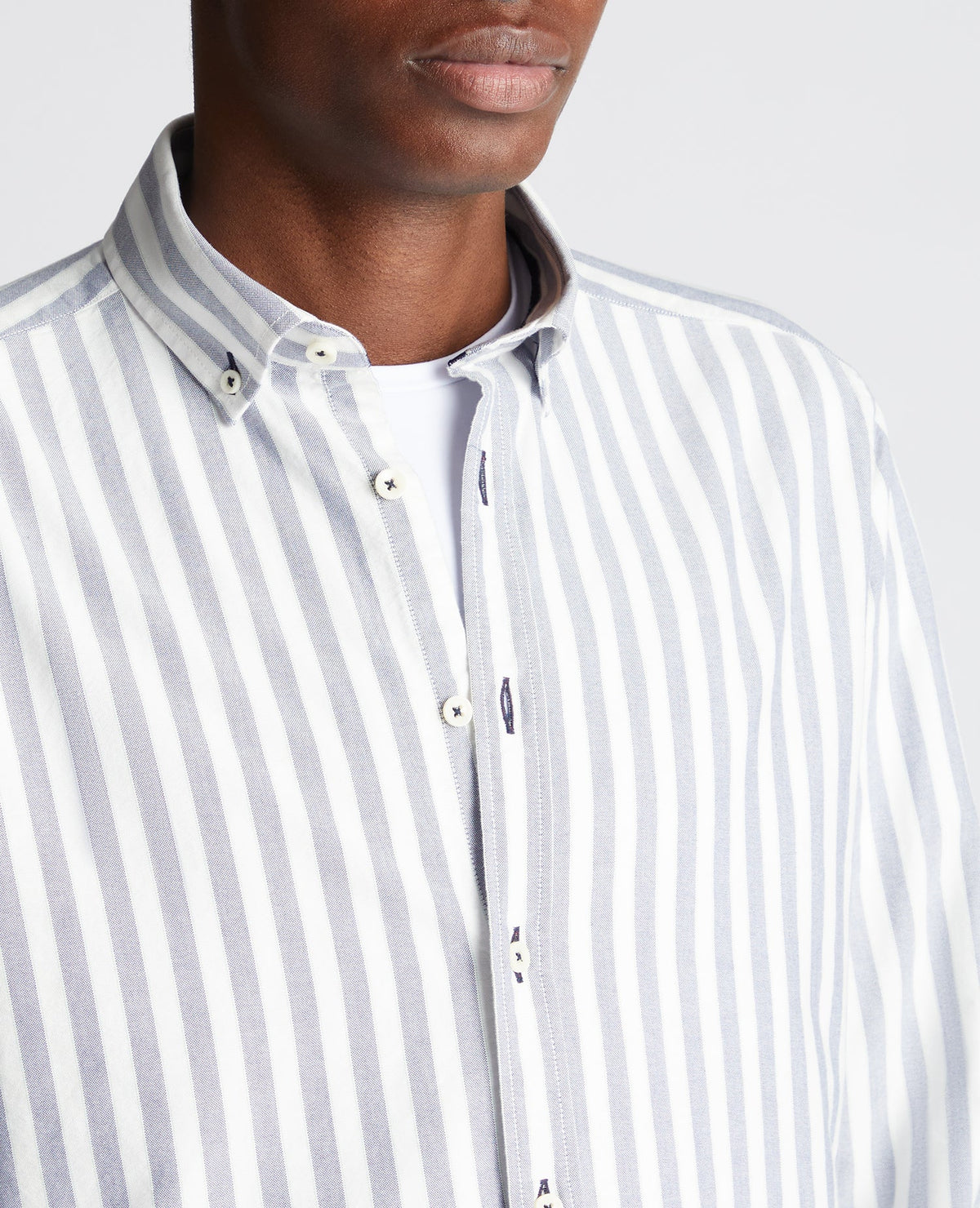 Man wearing a navy Tapered Fit Striped Cotton Shirt