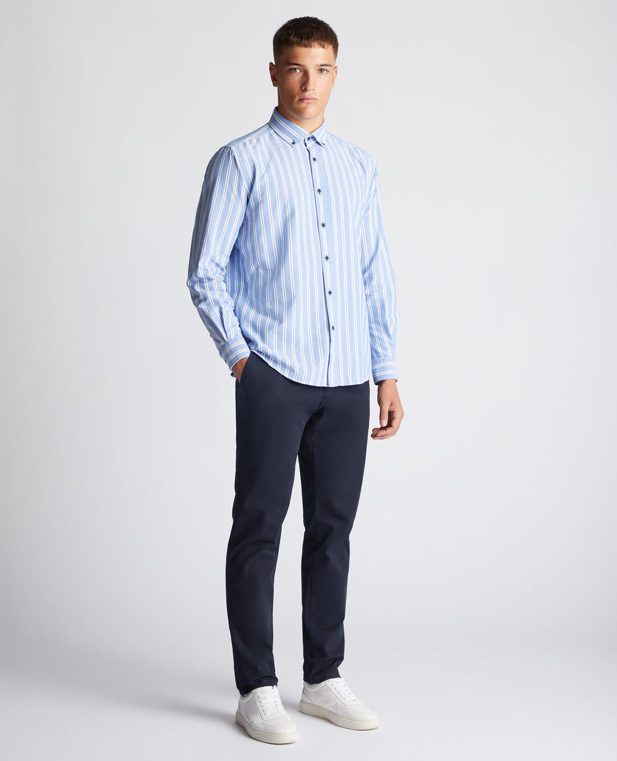 Man wearing a blue Tapered Fit Striped Cotton Shirt