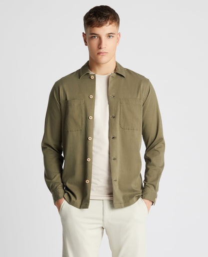 Man wearing a green Tapered Fit Long Sleeve Tencel Overshirt