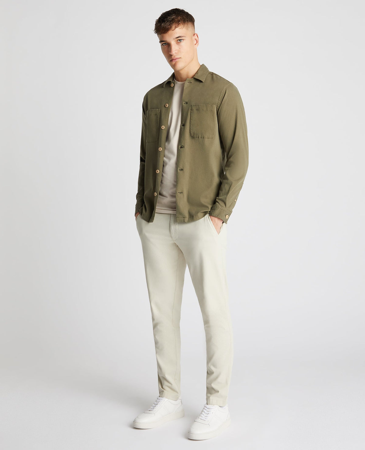 Man wearing a green Tapered Fit Long Sleeve Tencel Overshirt