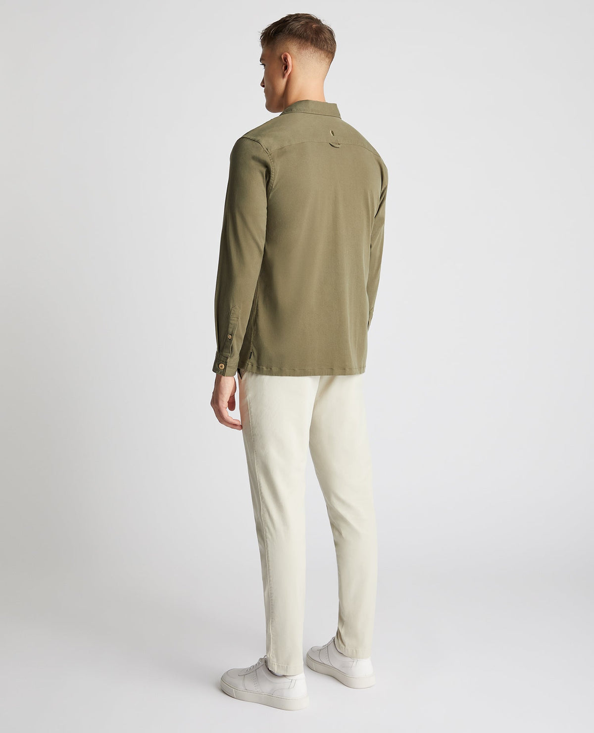 Man wearing a green Tapered Fit Long Sleeve Tencel Overshirt