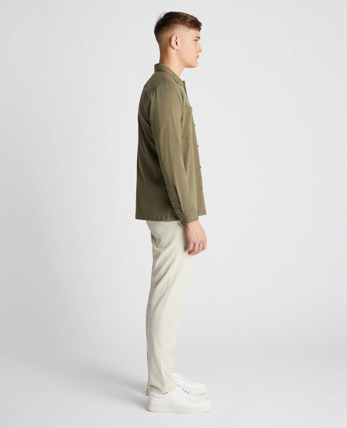 Man wearing a green Tapered Fit Long Sleeve Tencel Overshirt