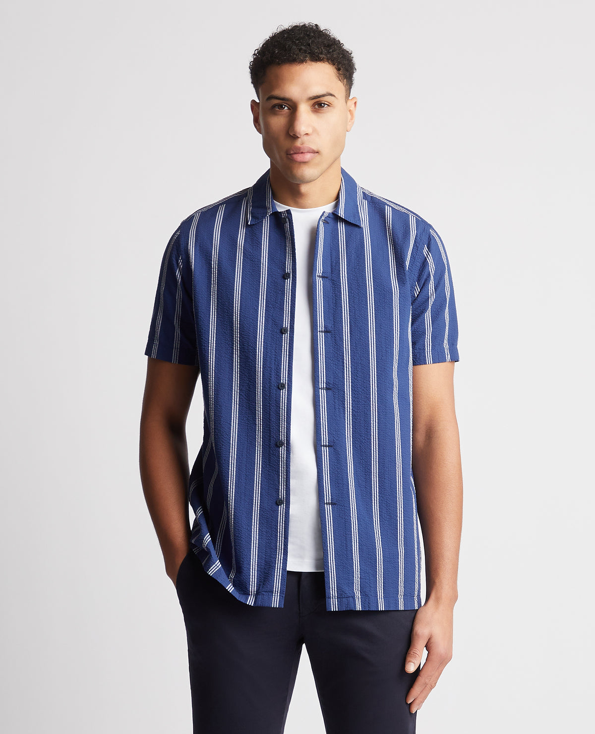 Man wearing a blue Tapered Fit Cotton Short Sleeve Shirt