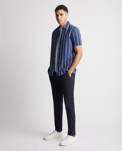 Man wearing a blue Tapered Fit Cotton Short Sleeve Shirt