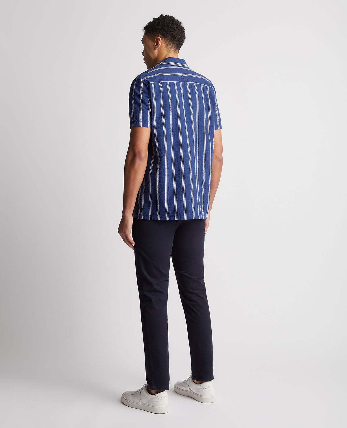 Man wearing a blue Tapered Fit Cotton Short Sleeve Shirt