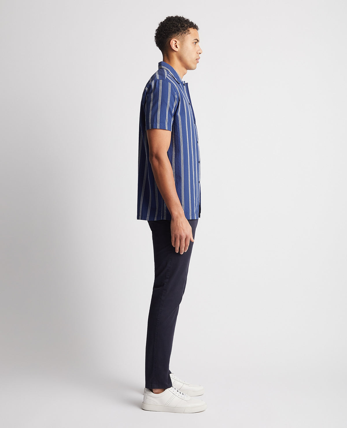 Man wearing a blue Tapered Fit Cotton Short Sleeve Shirt