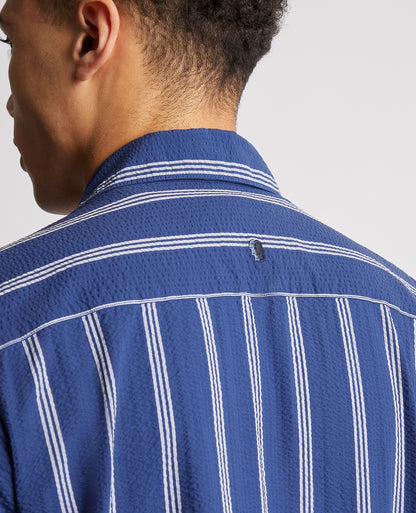 Man wearing a blue Tapered Fit Cotton Short Sleeve Shirt