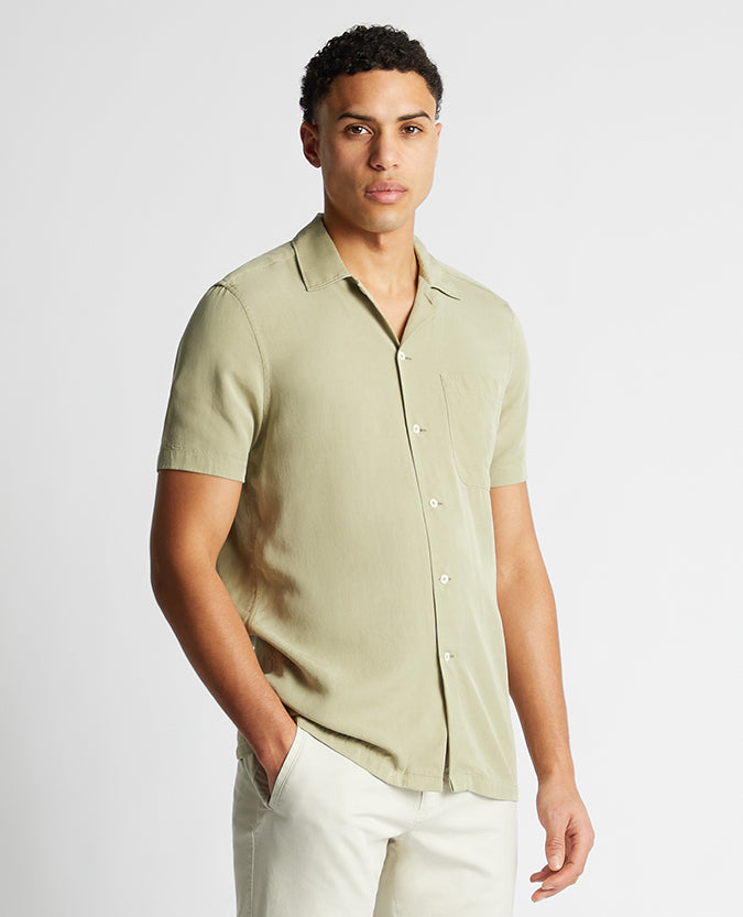 Man wearing a green Tapered Fit Short Sleeve Tencel Shirt