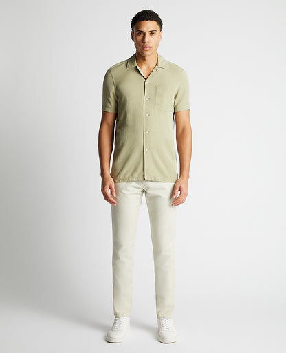 Man wearing a green Tapered Fit Short Sleeve Tencel Shirt