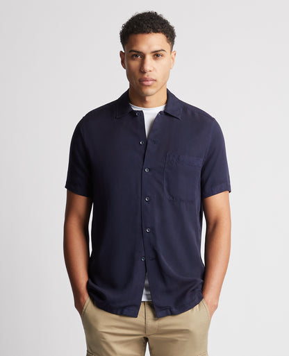 Man wearing a navy Tapered Fit Short Sleeve Tencel Shirt