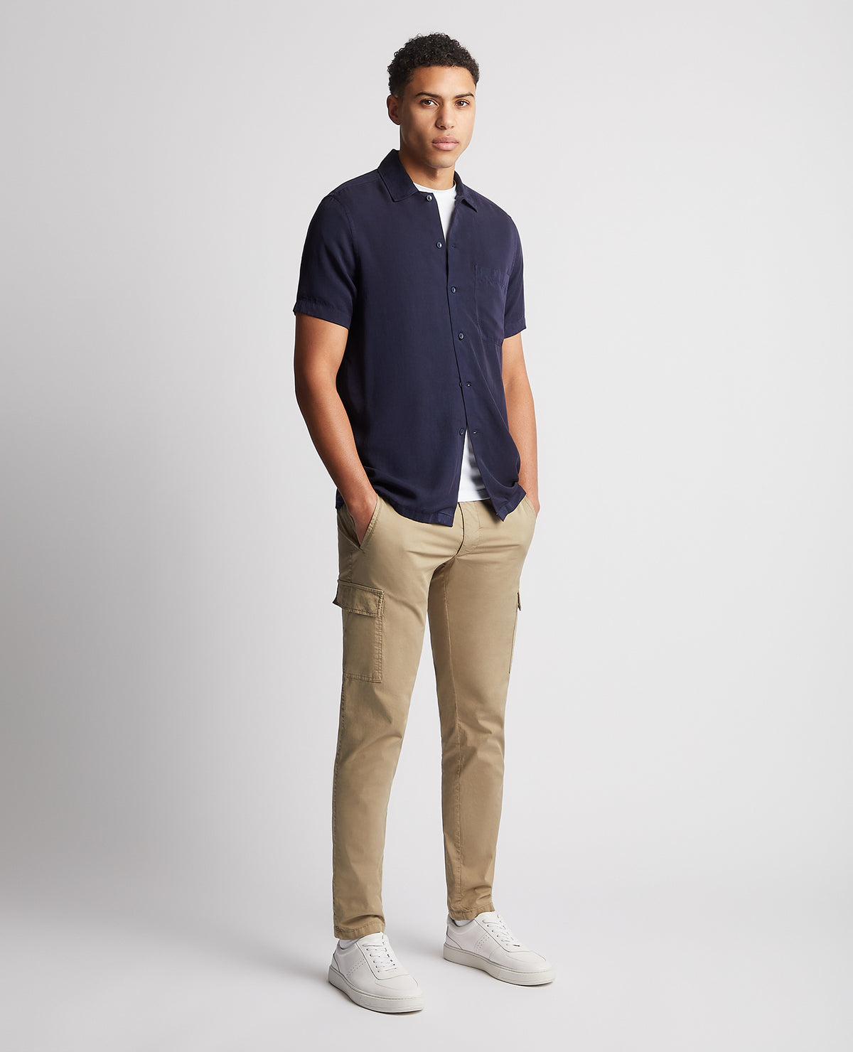 Man wearing a navy Tapered Fit Short Sleeve Tencel Shirt