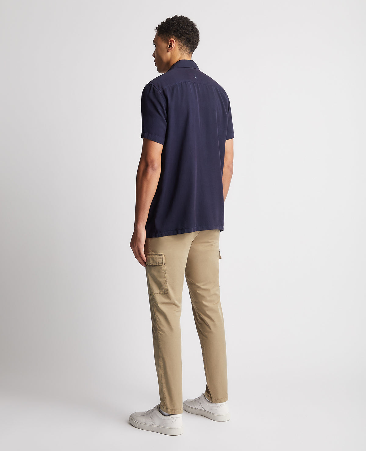 Man wearing a navy Tapered Fit Short Sleeve Tencel Shirt