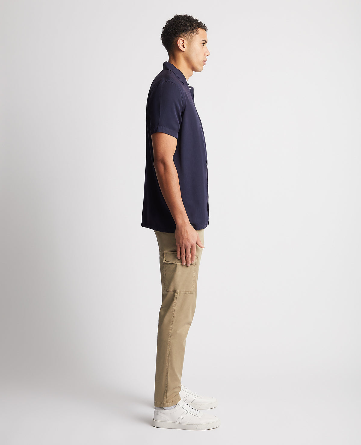 Man wearing a navy Tapered Fit Short Sleeve Tencel Shirt