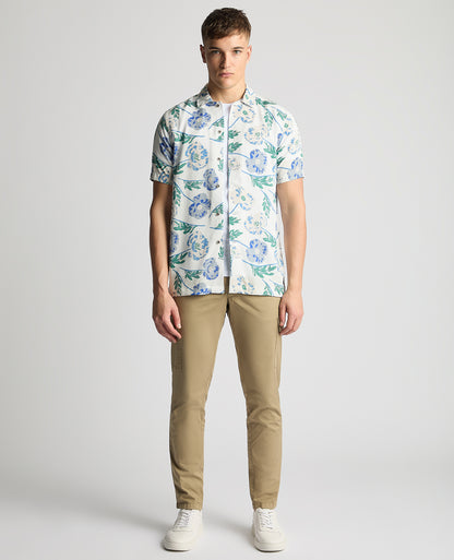 Man wearing a blue Tapered Fit Cotton Short Sleeve Floral Shirt