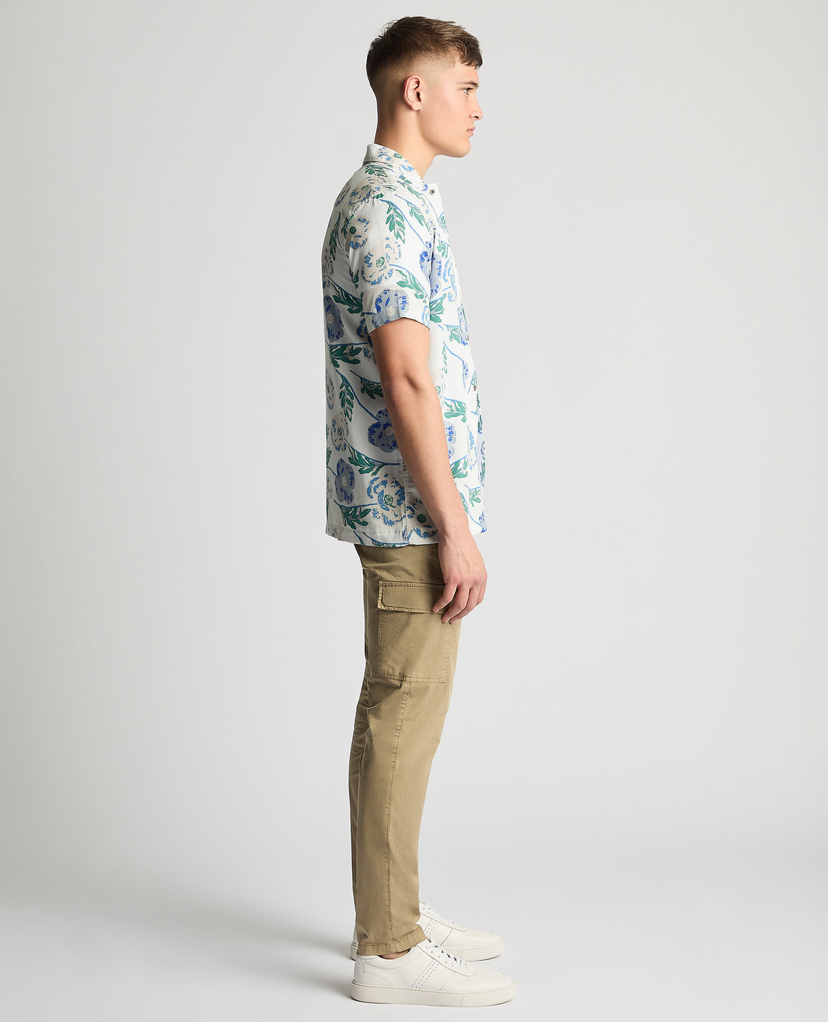 Man wearing a blue Tapered Fit Cotton Short Sleeve Floral Shirt