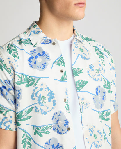 Man wearing a blue Tapered Fit Cotton Short Sleeve Floral Shirt