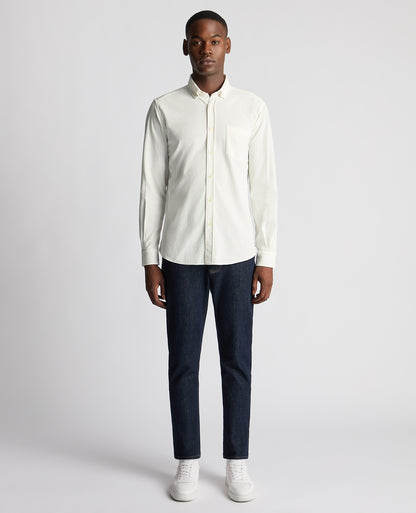 Man wearing a white Tapered Fit Micro Corduroy Shirt