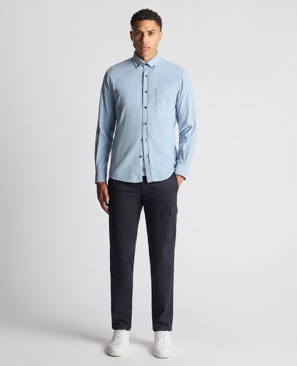 Man wearing a blue Tapered Fit Micro Corduroy Shirt