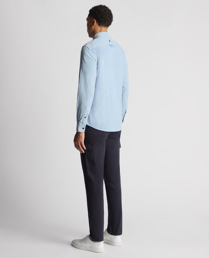 Man wearing a blue Tapered Fit Micro Corduroy Shirt