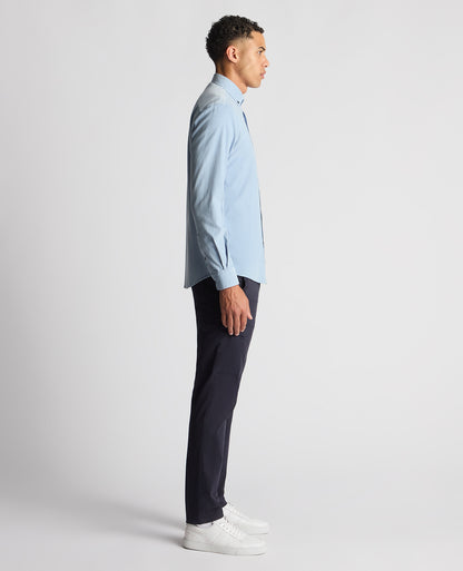 Man wearing a blue Tapered Fit Micro Corduroy Shirt