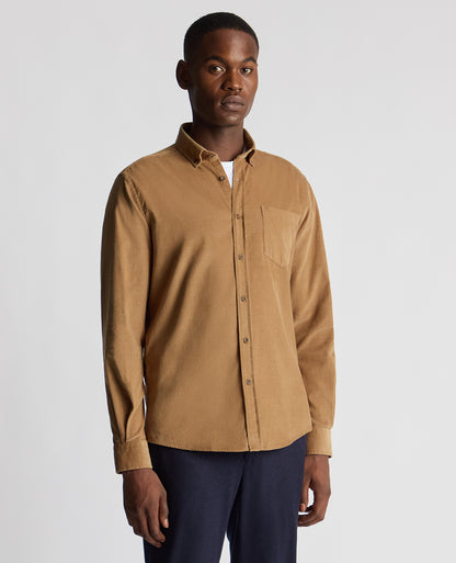 Man wearing a brown Tapered Fit Micro Corduroy Shirt