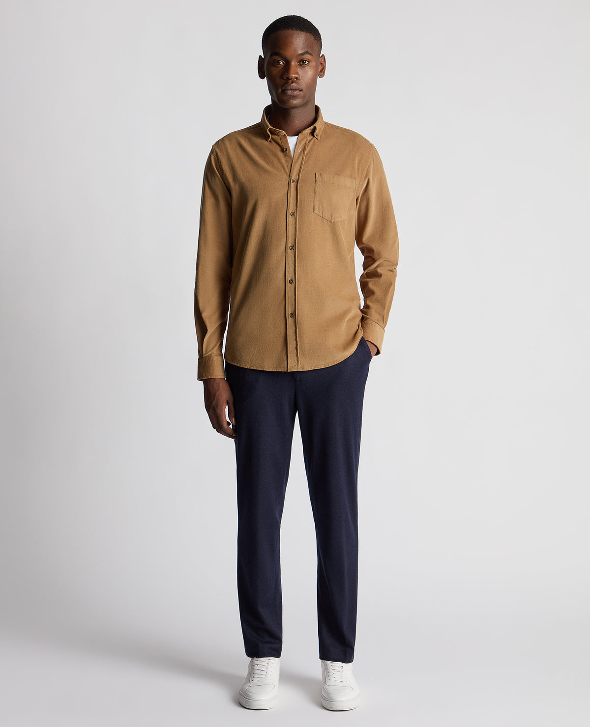 Man wearing a brown Tapered Fit Micro Corduroy Shirt