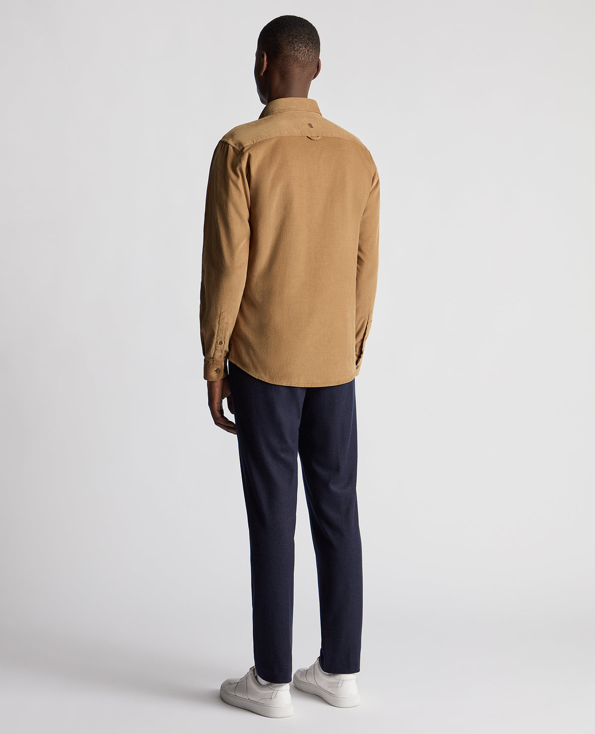 Man wearing a brown Tapered Fit Micro Corduroy Shirt