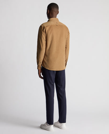 Man wearing a brown Tapered Fit Micro Corduroy Shirt